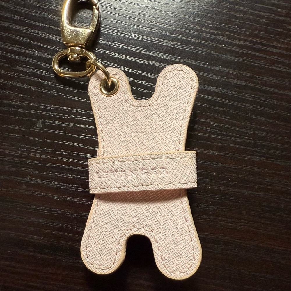 Lavenger leather keychain bag charm light pink & gold holder of ? Headphones
